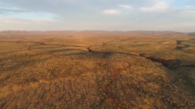 Wide aerial view of the desert in Australia flying high over Karijini.