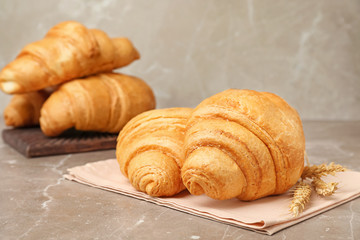 Tasty croissants served for breakfast on table