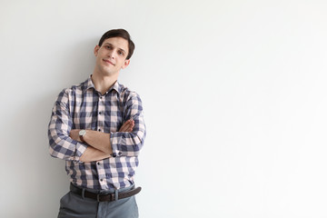 Portrait of confident young man on light background