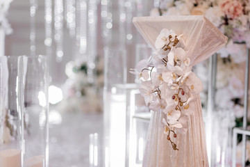 Festive decoration of wedding celebrations and ceremonies with white flowers and silver decorations