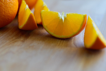 Oranges cut and set on wooden cutting board