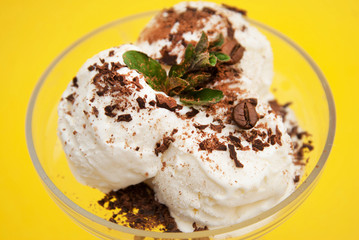 Vanilla Ice Cream Scoop in cup on Summer Yellow background