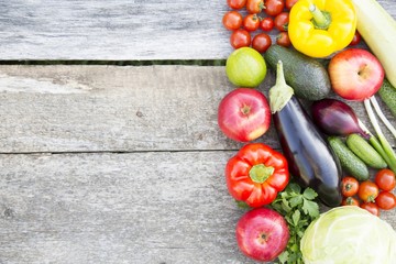 Set of various vegetables and fruits on rustic wooden background, top view. From above. Copy space.