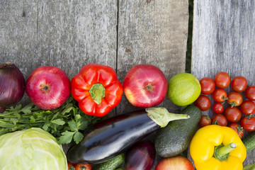 Set of various fruits and vegetables on rustic wooden background, top view. From above. Copy space.