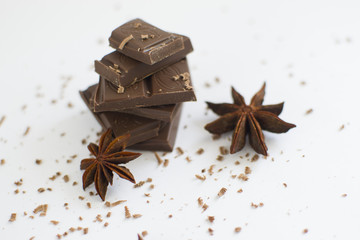 pyramid of chocolate pieces and star anise close up