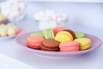Birthday party concept. Sweet candy bar at the birthday party. Selective focus. Dessert table with macaroons and marshmallow.