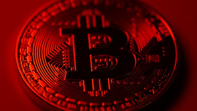 Representation of the digital Cryptocurrency in red color.