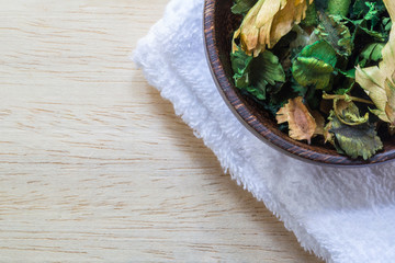 Dried flowers in a bowl on table