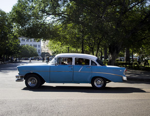 Havana, Cuba, 10 February 2018: American antique car, vintage style, rolling through the streets of Havana, Cuba