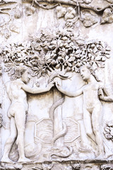 Detail of the facade of the Duomo of Orvieto, Italy. Marble bas-relief representing episodes of the bible. Adam and Eve