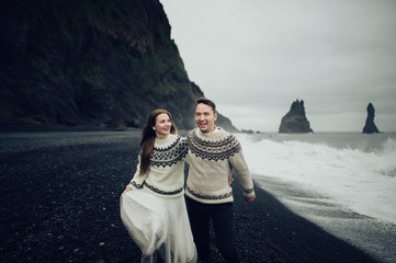 Amazing romantic view of happy couple near beautiful grand water