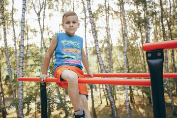 Fototapeta premium boy exercising in park