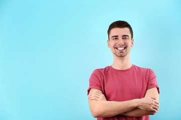 Charming young man on color background