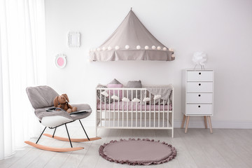Interior of baby room with comfortable crib