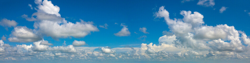 panorama Sunlight with blue sky on dark background.Vivid sky on white cloud.