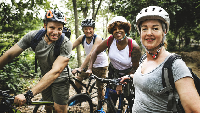 Group of friends out bicycling together - Powered by Adobe