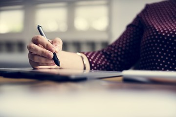 Close up of people's hand working on computer