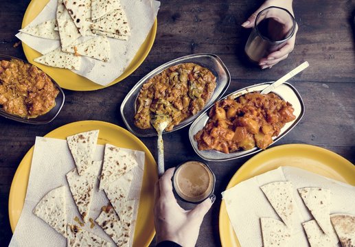 Aerial view of couple enjoying Rajasthani cuisine