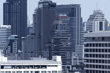 Density office buildings in modern city district.
