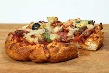 Pizza beef chicken peperoni cheese chilli capsicum onion olive on wooden board