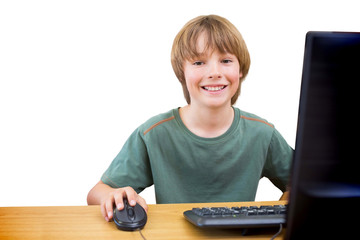 Fototapeta na wymiar School kid on computer against white background with vignette