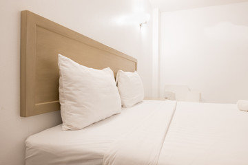 Fototapeta na wymiar Minimalistic interior of white bedroom.
