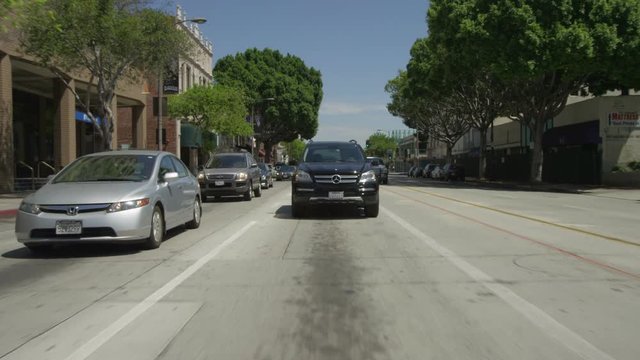 Rear view of a Driving Plate: Car travels on East Colorado Boulevard through downtown Pasadena, California from North Lake Avenue to North Arroyo Parkway.