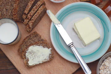Healthy Breakfast. Fitness food. Eggs, Bread, Butter, Milk. Wooden Background. Flat Lay.
