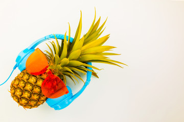 Fashion Hipster Pineapple on background, Bright Summer Color, Tropical Fruit with Sunglasses, Creative Art concept. Minimal style,Hot Beach Vibes. Fun Party Mood
