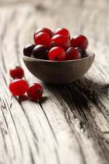 Cranberries close-up on old wood