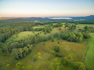 Obraz premium Aerial view of rural area and Myall Lake at sunset. Topi Topi, New South Wales, Australia