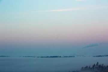 View towards Avedoere and Amager from Oerestad early in the morning. Fog rising from the ground makes this a dreamy scene.