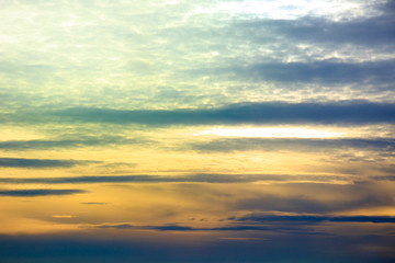 Fototapeta na wymiar Cumulus sunset clouds with colorful sun setting down