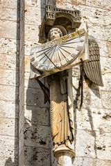 Angel with sundial - architecture details of North facade of Cathedral of Our Lady of Chartres