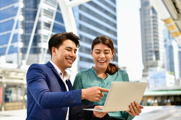 Young business people are working outside the office.