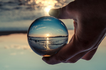Glass ball in hand