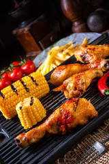Rustic Grilled chicken wings,legs,and spicy corn