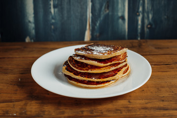 pancake on a table in a white plate