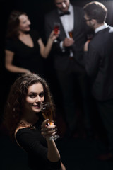 stylish young woman with glass of champagne