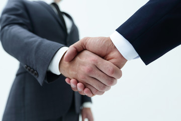 Businessman by handshake invites to cooperation.