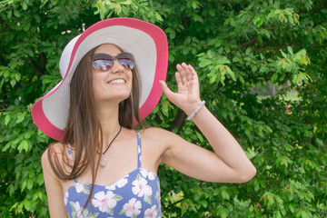 Pretty girl in sunglasses and hat