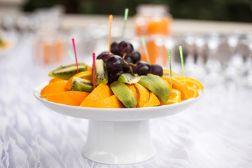 a served table for the wedding ceremony. fruit dish