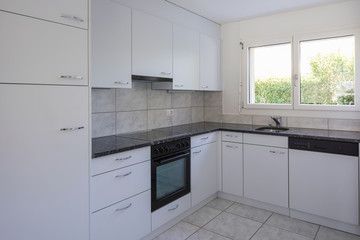 Vintage white kitchen with large tiles