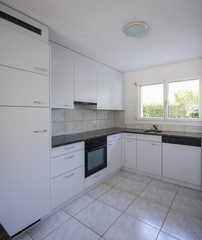 Vintage white kitchen with large tiles