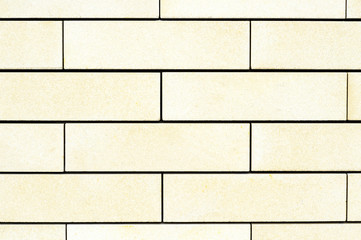 Natural texture of a large light yellow brick.Background.