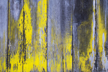 Rustic yellow black wood background / Weathered scratched yellow black wooden background.