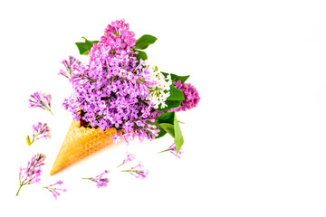 Flowers composition. Lilac in waffle cone. Flat lay, top view, copy space. Concept of proposal, attraction, gratitude, tenderness and love.