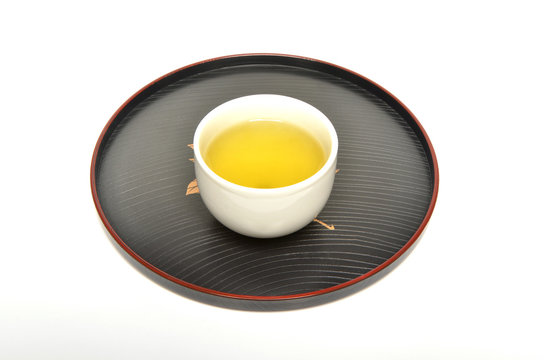 Cup of green tea on a Japanese style tray   