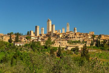 City postcard view and towers of San Gimignano, small medieval town in Tuscany, Italy - obrazy, fototapety, plakaty