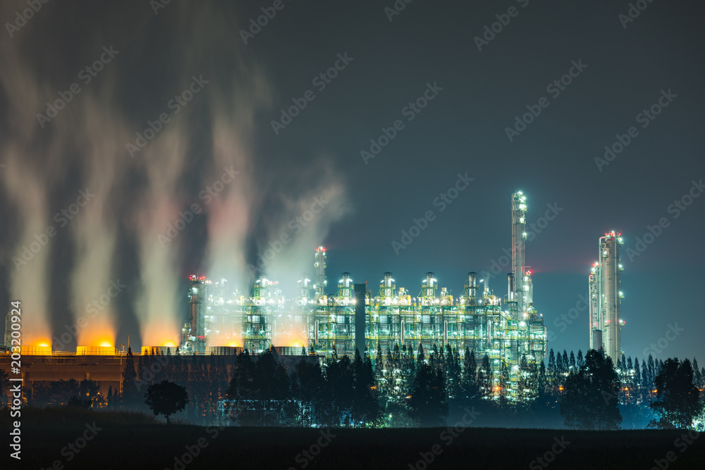 Wall mural Oil and gas refinery plant area at twilight